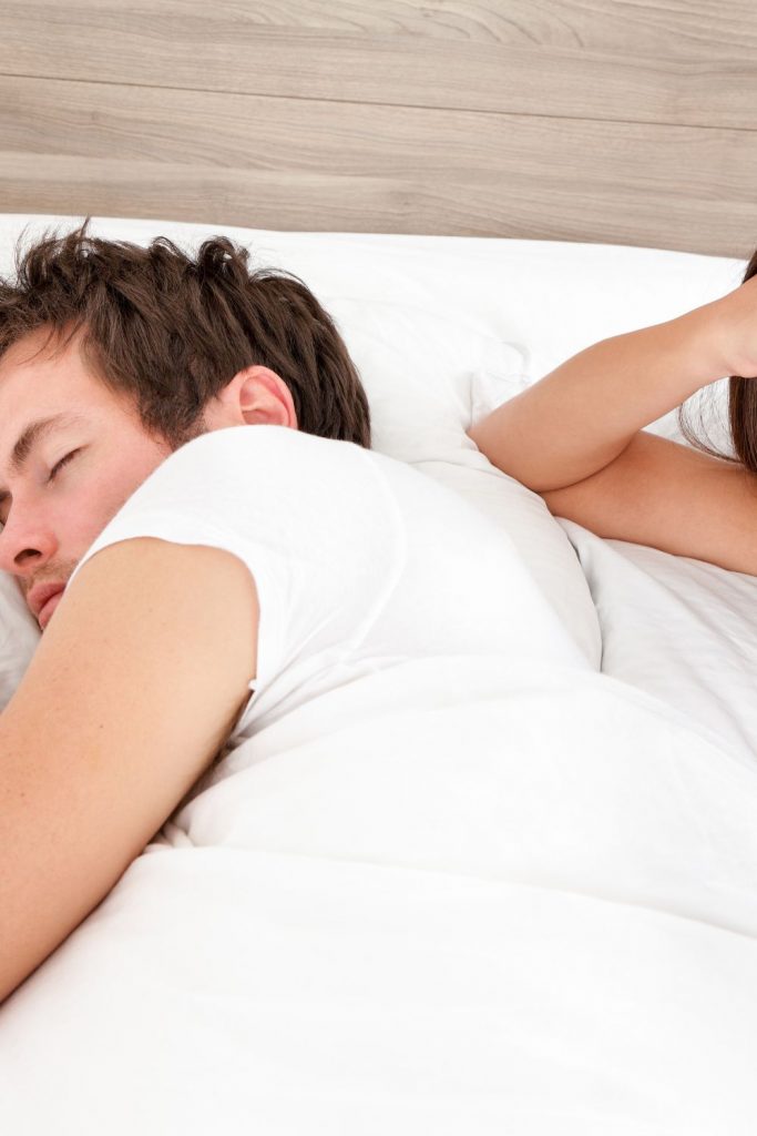 what does it mean when your husband sleeps with his back to you