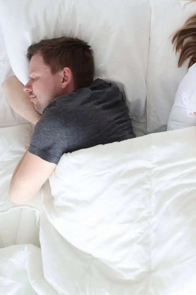 what does it mean when your husband sleeps with his back to you