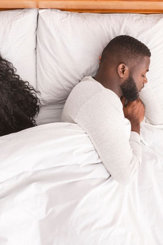 what does it mean when your husband sleeps with his back to you